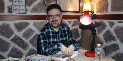 Down sendromlu Canberk renkli dünyasıyla dikkat çekiyor